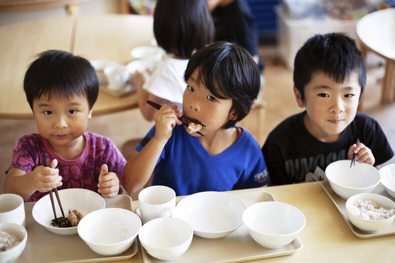 Three boys eating school lunch - resized